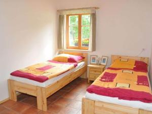 Un pat sau paturi într-o cameră la Spacious Holiday Home in Dlouh with Sauna