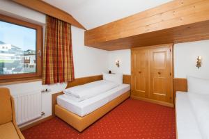 Ein Bett oder Betten in einem Zimmer der Unterkunft Apart Faldershof