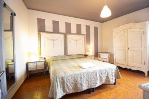 a bedroom with a bed in a room at Hotel PRime in Pistoia