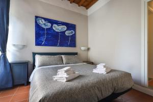 A bed or beds in a room at Florence in the window- Unique view