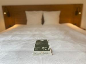 A bed or beds in a room at Hotel Dalgas, BW Signature Collection