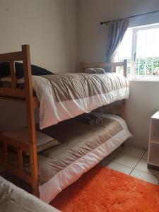 Postel nebo postele na pokoji v ubytování Keedols Inn & Backpackers
