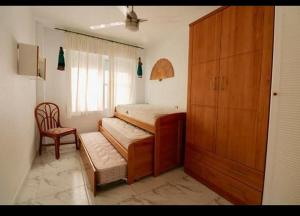 Posteľ alebo postele v izbe v ubytovaní Apartamento la isla