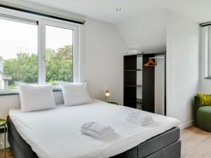 Postel nebo postele na pokoji v ubytování Bungalow in Texel near National Park Dunes