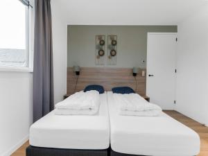 Krevet ili kreveti u jedinici u okviru objekta Wonderful Holiday Home in De Koog Texel with Terrace