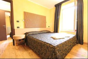 A bed or beds in a room at Suite - La Casa del Maestro