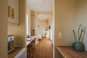 Kuchyň nebo kuchyňský kout v ubytování Living Stone Aparthotel