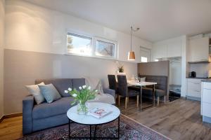 a living room with a couch and a table at Apartment Bianca in Salzburg