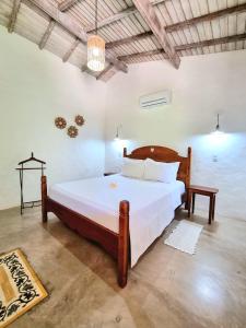 Postel nebo postele na pokoji v ubytování Pousada Villages Boutique Hotel - 150m da Praia da Laje + 37 fotografií