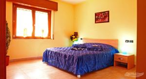 A bed or beds in a room at Affittacamere La Martina