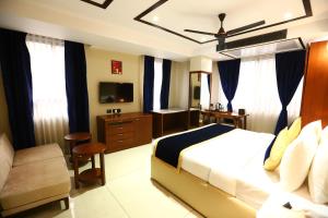 Postel nebo postele na pokoji v ubytování Sanca International Hotel in Patel Nagar Delhi + 37 fotografií