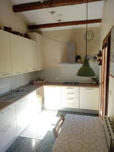 A kitchen or kitchenette at La Mansarda