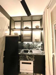 Kuchyň nebo kuchyňský kout v ubytování madrid central gran via Suites