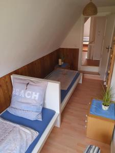 a small room with two beds in a room at Sonnenhaus in Kramerhof