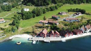 an aerial view of a house on an island in the water at Furrehytter in Sjernarøy