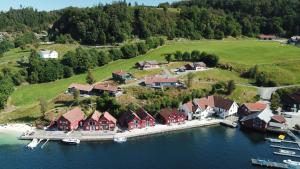 an aerial view of a house on an island in the water at Furrehytter in Sjernarøy