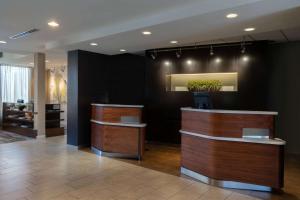 a lobby with two reception desks in a building at Sonesta Select Pleasant Hill in Pleasant Hill