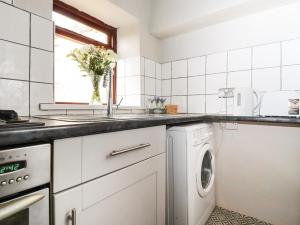 Køkken eller tekøkken på Teddy Bear Cottage + 6 billeder