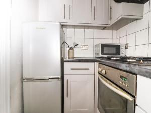 Køkken eller tekøkken på Teddy Bear Cottage