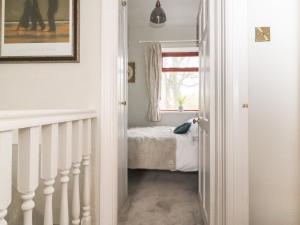 En eller flere senge i et værelse på Teddy Bear Cottage