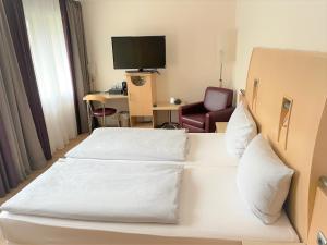 Postel nebo postele na pokoji v ubytování Park Hotel am Berliner Tor