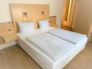 Postel nebo postele na pokoji v ubytování Park Hotel am Berliner Tor
