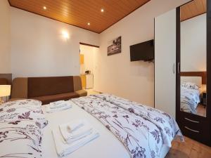 Postel nebo postele na pokoji v ubytování Apartments Vujina