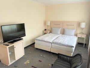 Postel nebo postele na pokoji v ubytování Park Hotel am Berliner Tor