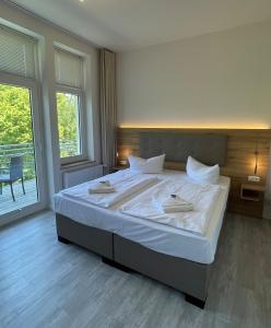 Säng eller sängar i ett rum på Strandresidenz Villa Verdi