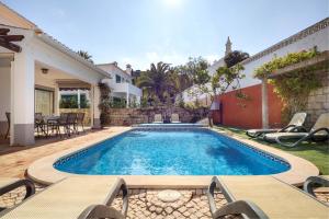 a swimming pool in the backyard of a house at Villa Goshen in Lagos