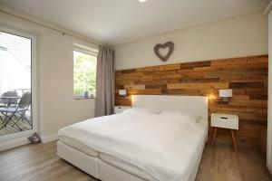 Postel nebo postele na pokoji v ubytování Residenz Seestern Wohnung 39 + 29 fotografií