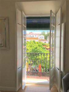 an open door with a view of a balcony at Apartamento Plaza de Los Naranjos Marbella in Marbella