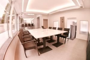 a large dining room with a long table and chairs at Villa na Vinici in Prague