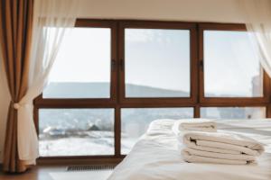 Ένα ή περισσότερα κρεβάτια σε δωμάτιο στο The K Guest House