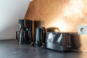 a coffee maker sitting on top of a counter at Familienapartment Am Neumarkt l in Dresden