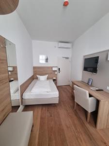 Postel nebo postele na pokoji v ubytování Hotel Perkeo