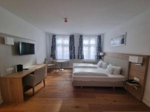 TV a/nebo společenská místnost v ubytování Hotel Perkeo