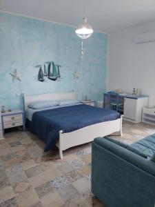A bed or beds in a room at B&B LA COLIMENA