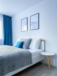 Posteľ alebo postele v izbe v ubytovaní LAWIS Apartments