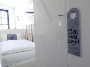 Ein Bett oder Betten in einem Zimmer der Unterkunft Hotel Neumaier