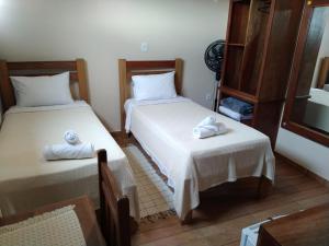 Postel nebo postele na pokoji v ubytování Pousada Mariart