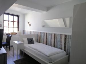 Ein Bett oder Betten in einem Zimmer der Unterkunft Hotel Neumaier