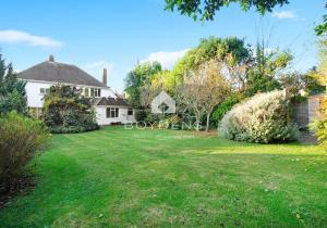 a house with a large lawn in front of it at The Avenues, Frinton on Sea in Frinton-on-Sea