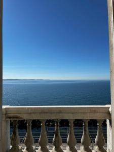 a view of the ocean from a balcony at Villa Tergeste in Trieste