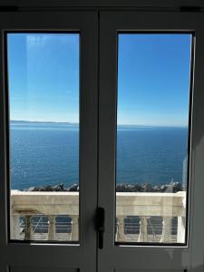 a view of the ocean from a window at Villa Tergeste in Trieste
