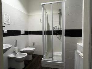 a bathroom with a shower and a toilet and a sink at Villa Tergeste in Trieste