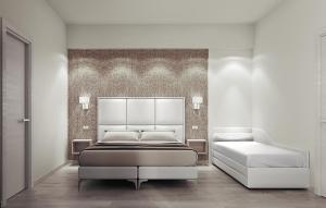 A bed or beds in a room at Hotel Fabius