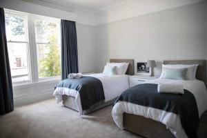 מיטה או מיטות בחדר ב-Whitecraigs