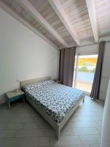 Säng eller sängar i ett rum på Casa Vacanze Stelle Marine