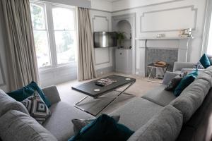 a living room with a couch and a table at Whitecraigs in Elgin